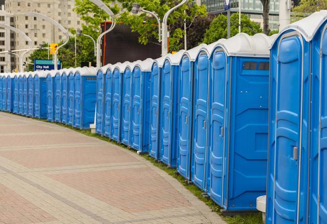 a row of portable restrooms at a fairground, offering visitors a clean and hassle-free experience in alvo